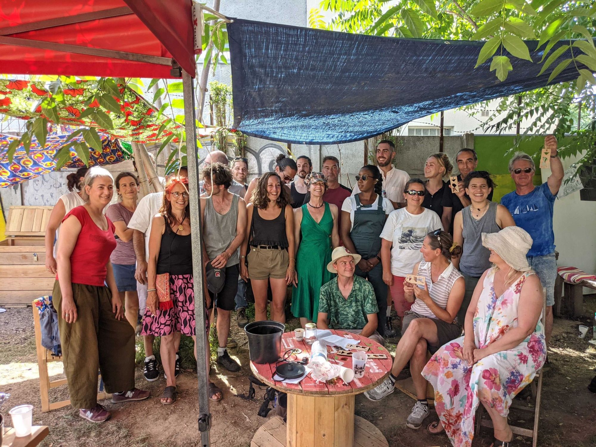 Group photo of people outdoor in a hot day